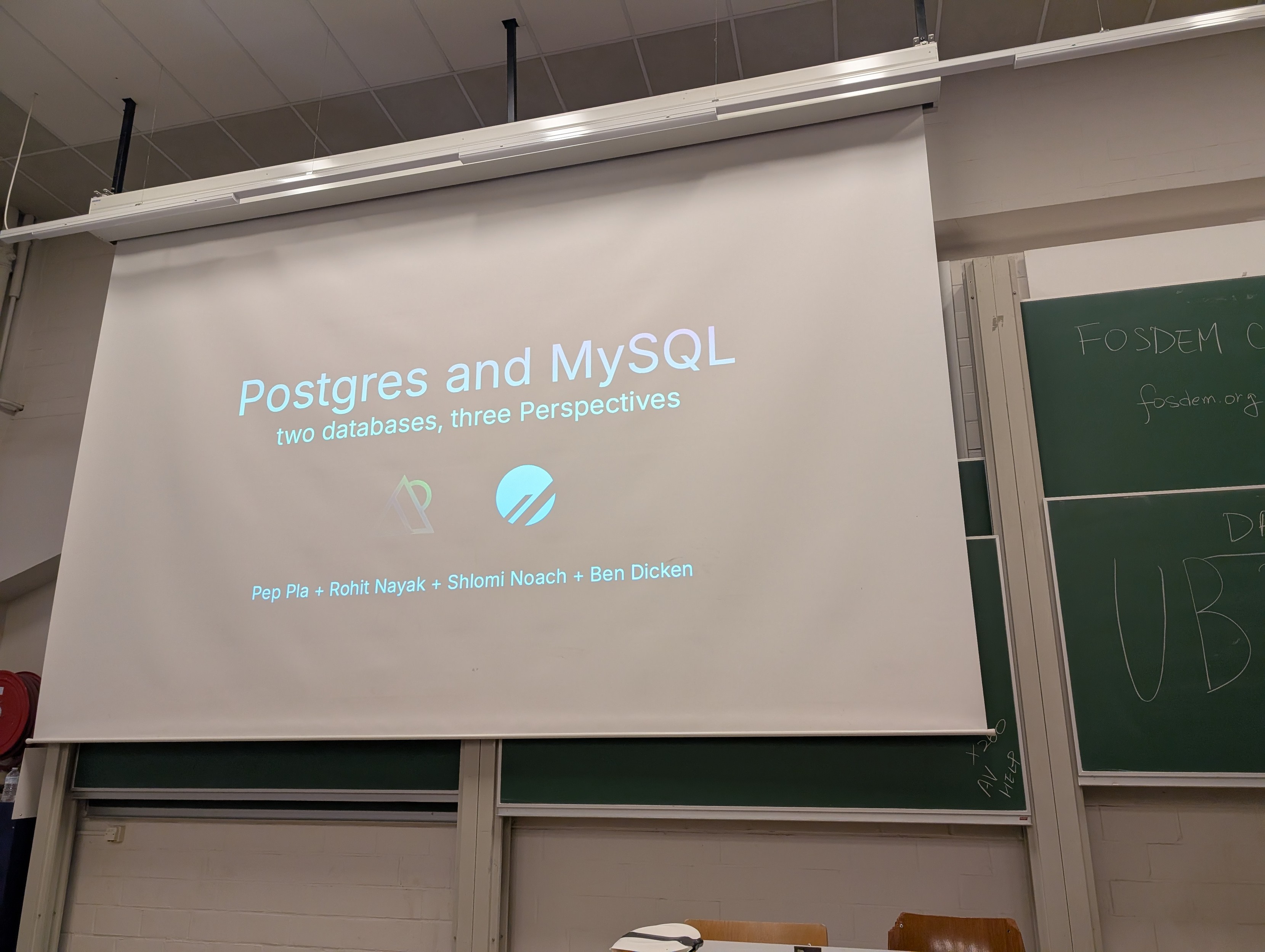Postgres and MySQL slides on a projector screen