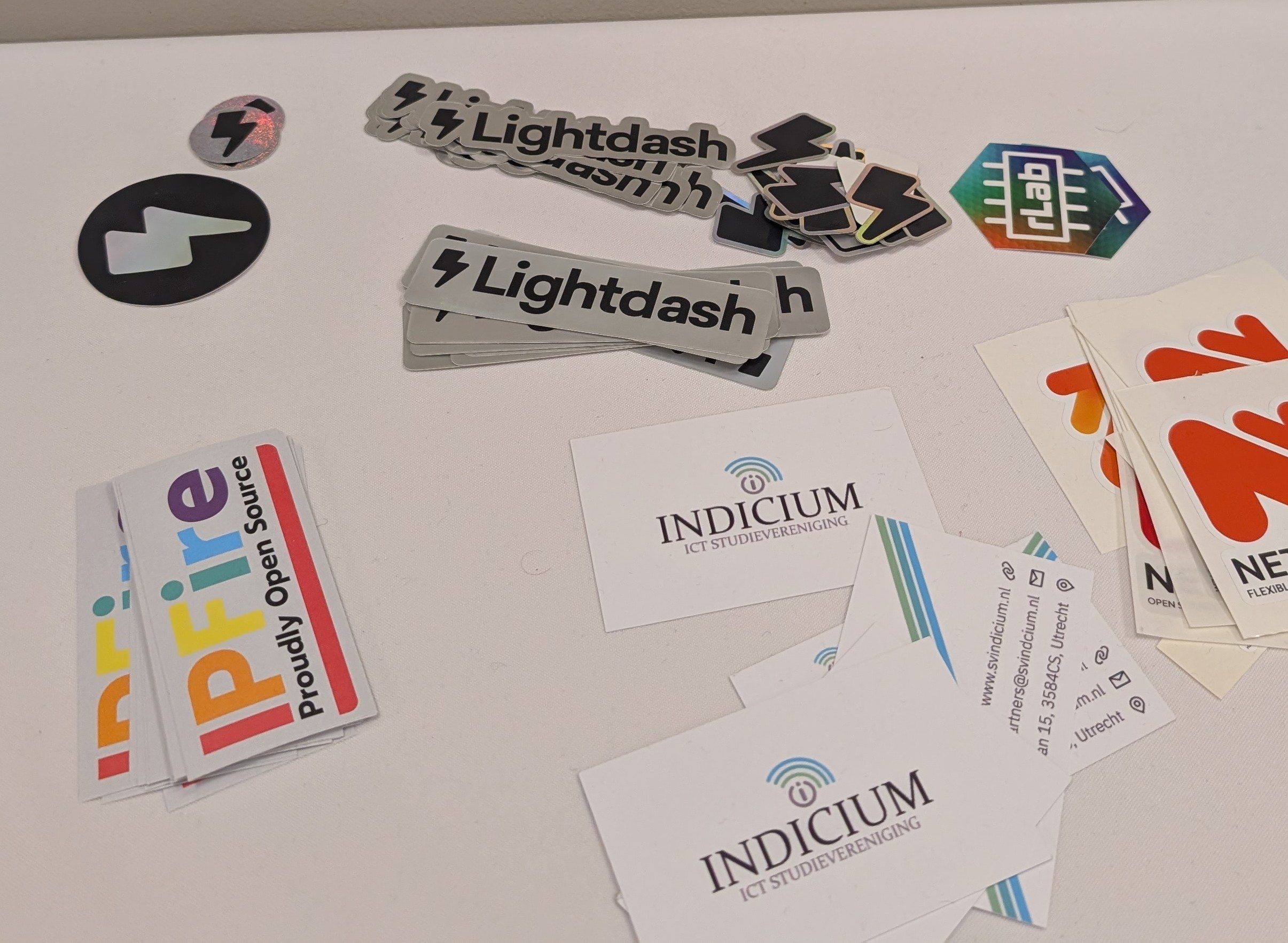 Some stickers on the table, including lots of Lighdash ones